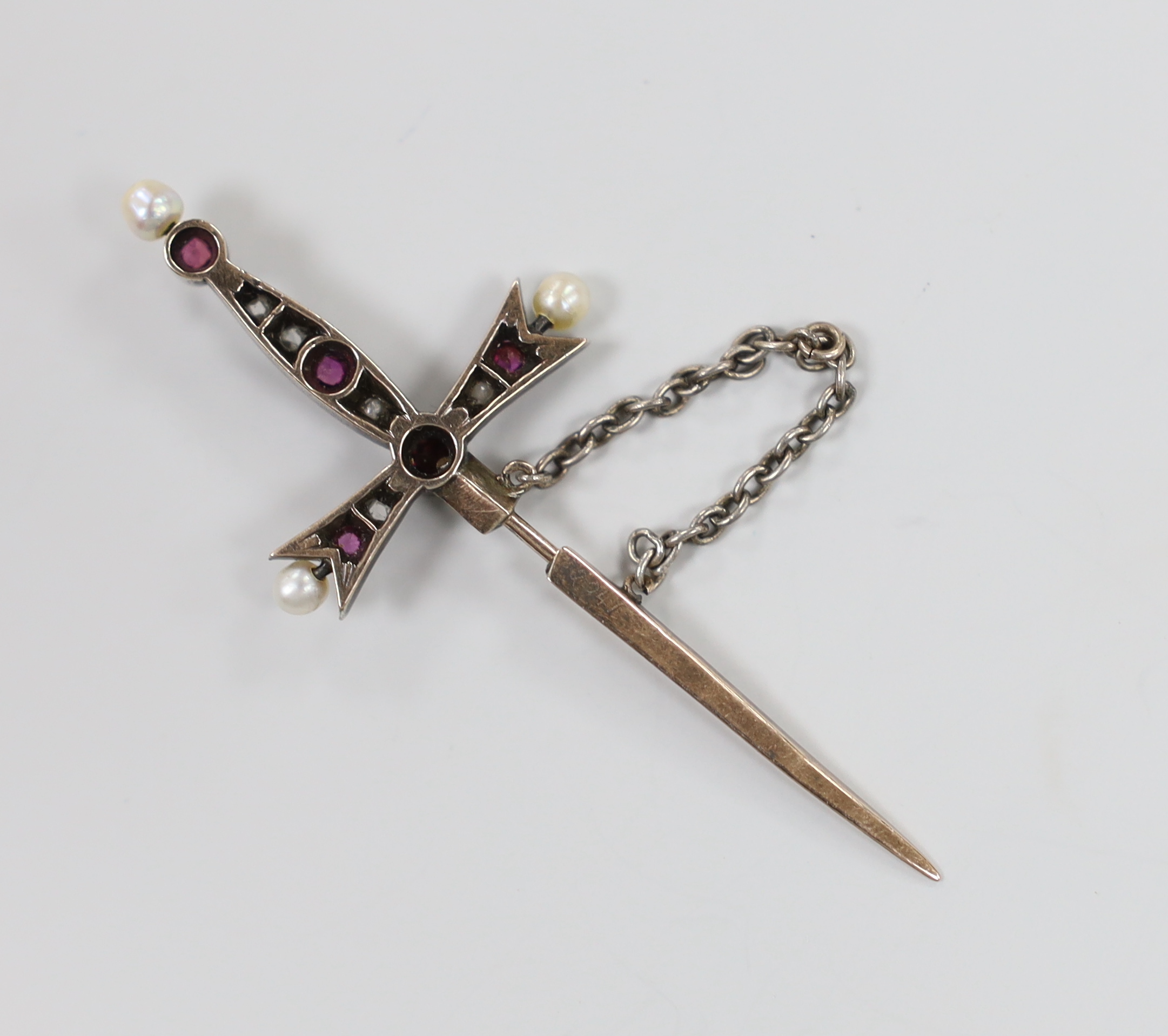 An Edwardian yellow and white metal, rose cut diamond, seed pearl and ruby? set 'sword and scabbard' jabot pin, 58mm, gross weight 3.3 grams.